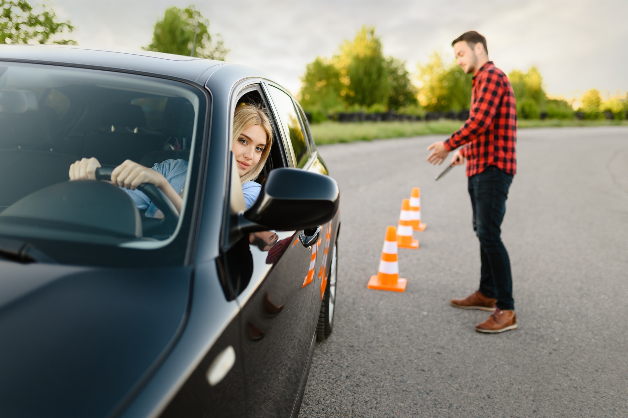 male-instructor-happy-with-driving-of-his-student.jpg